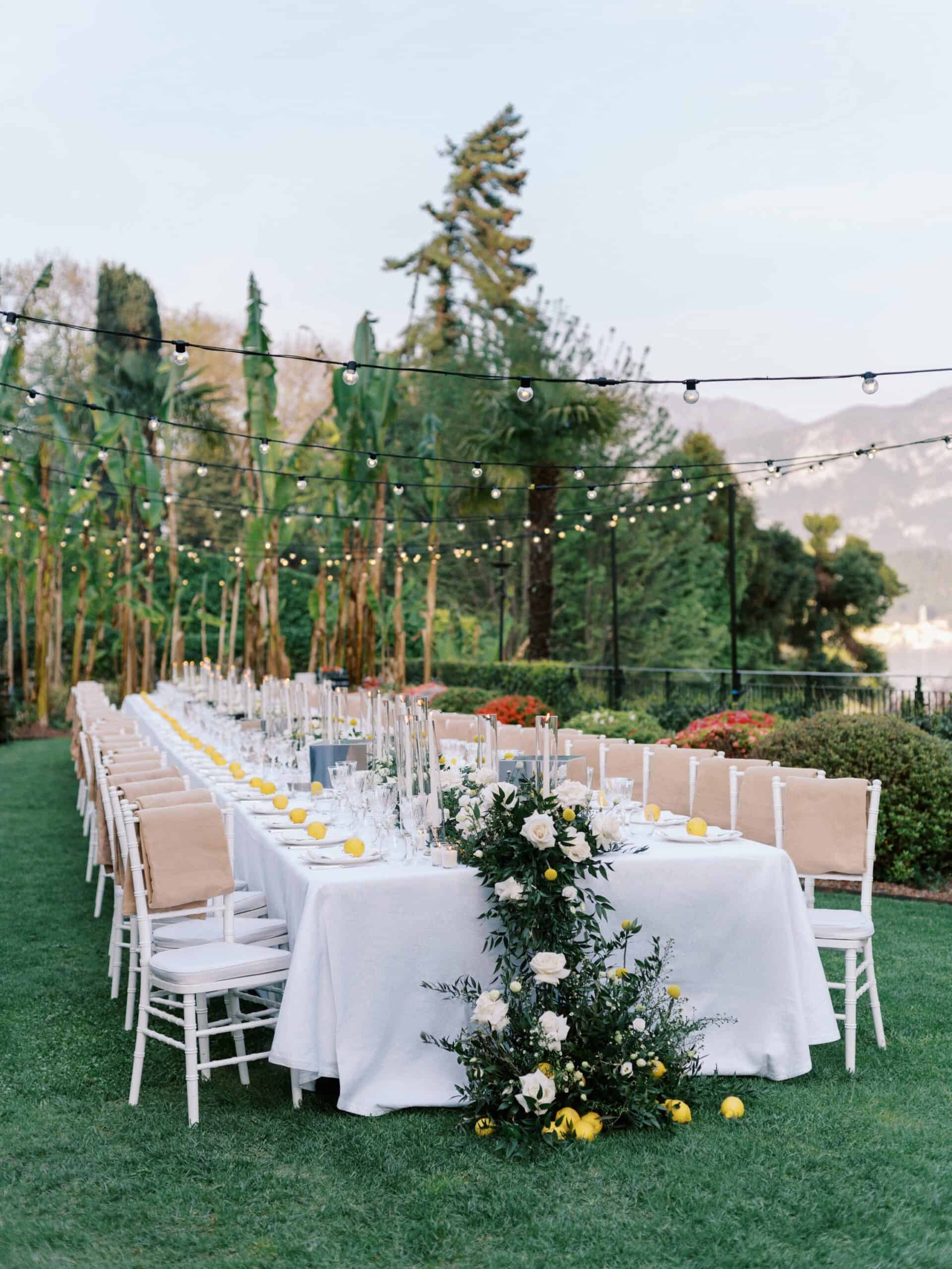 Long wedding welcome dinner table setup with greenery at Grand Hotel Tremezzo