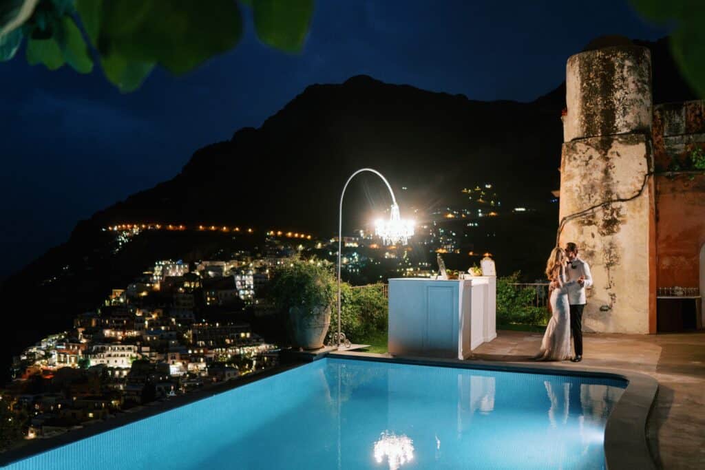 Elegant bride and groom on the balcony of Villa San Giacomo