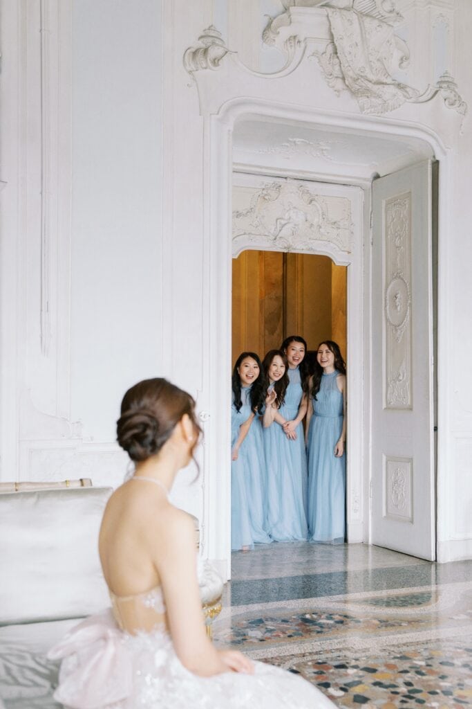 Bride with bridesmaids in blue gowns at Villa Sola Cabiati
