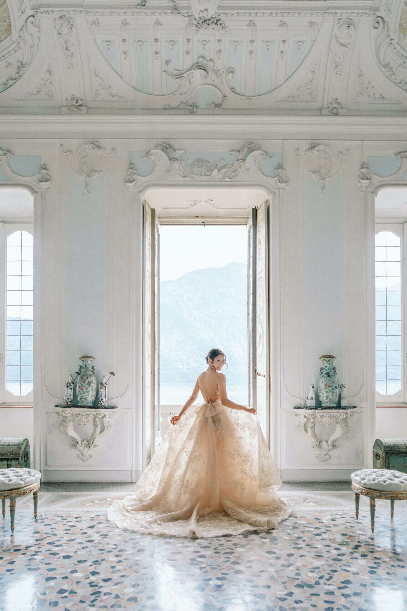 Asian bride in Berta gown posing inside Villa Sola Cabiati
