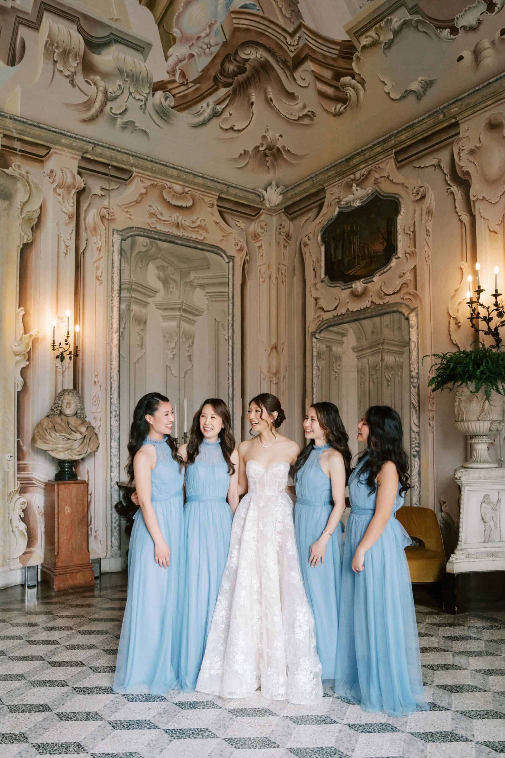 Bride with bridesmaids in blue gowns at Villa Sola Cabiati