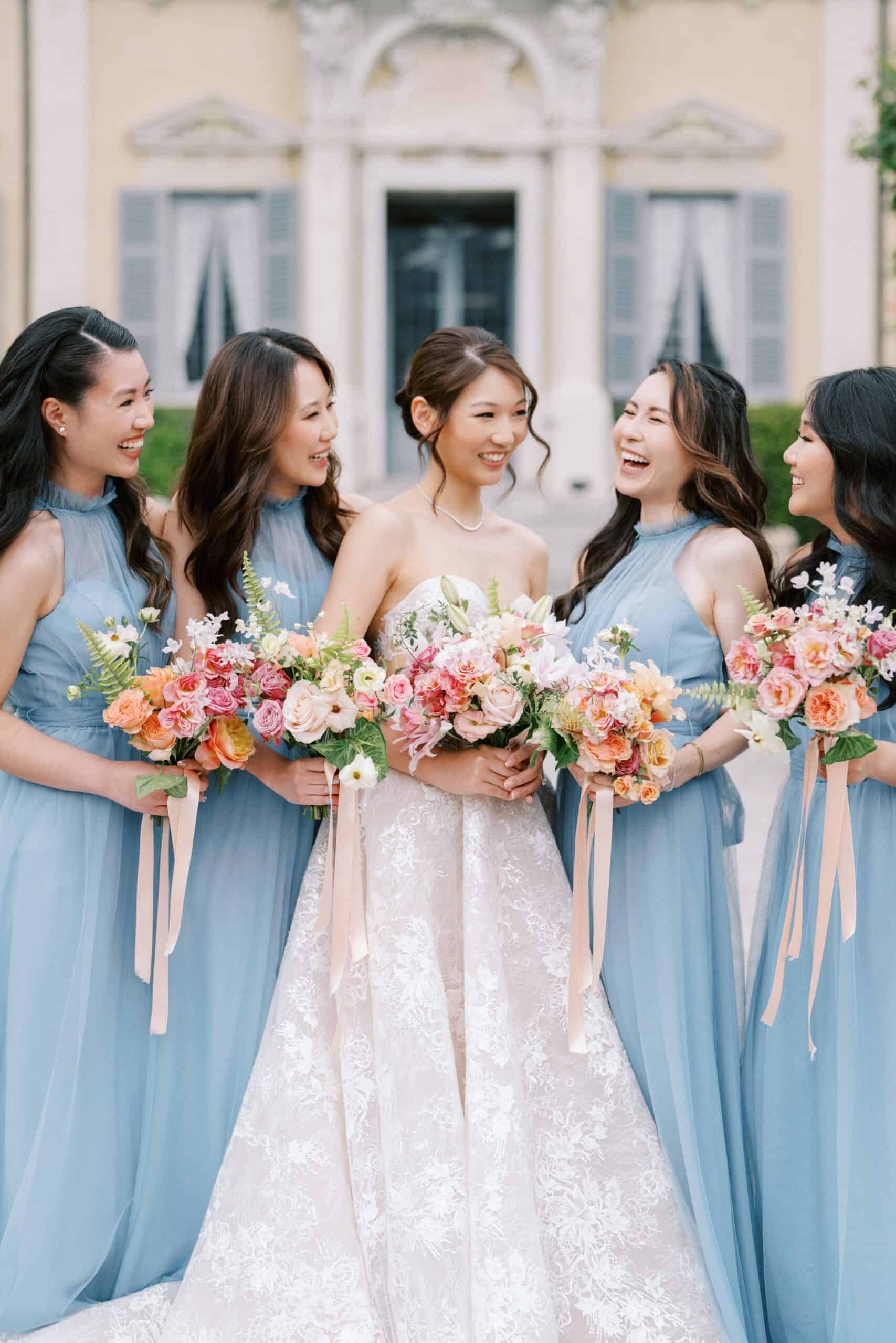 Bride with bridesmaids in blue gowns at Villa Sola Cabiati