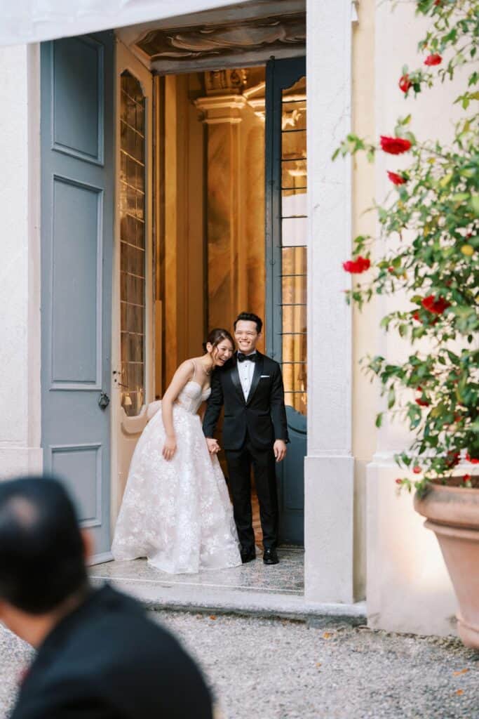 Bride and Groom posing in Villa Sola Cabiati gardens
